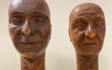 PAIR ONE PIECE CARVED WOOD HEADS