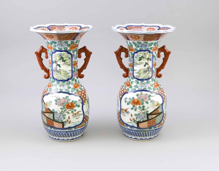 Pair of Japanese Export Vases with Imari-style Decor, Japan, Mid-19th C. Slightly bulbous shape with 2 large reserves of flowering peonies and birds. Long, cylindrical neck with two landscape figurines in matching cartouches. Curved rim. Iron red...