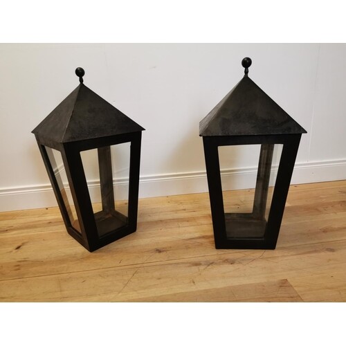 Pair of cast iron candle holders. {74 cm H x 36 cm W x 36 c...