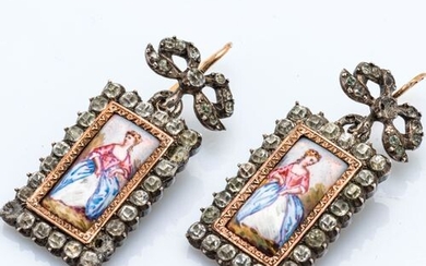 Pair of silver ear pendants (800 thousandths) each holding a...