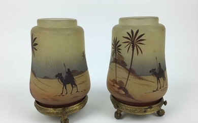 Pair of small glass nightlights decorated with Egyptian scenes on gilt metal stands