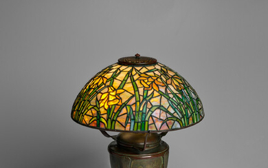 TIFFANY STUDIOS (1899-1930) Daffodil Table Lamp1902-04on Classical Base, leaded glass and patinated bronze, shade stamped 'TIFFANY STUDIOS NEW YORK', base stamped 'TIFFANY STUDIOS NEW YORK'height 21in (54cm); diameter of shade 16in (41cm)