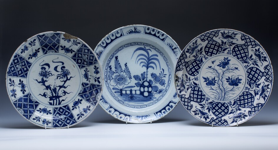 Three Delft blue and white chargers