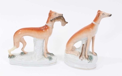 Two Victorian Staffordshire figures of greyhounds, the largest measuring 21cm height