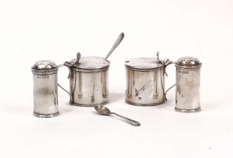 Two pairs of Edwardian silver cruets, the peppers c.1908, Elkington & Co., the blue glass-lined mustards Birmingham, c.1909, same maker, all with reeded banding and the initial 'Y' engraved to body or lid, the mustards with shell thumbpieces to...