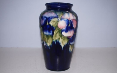 William Moorcroft pansy pattern vase. Height 22 cm