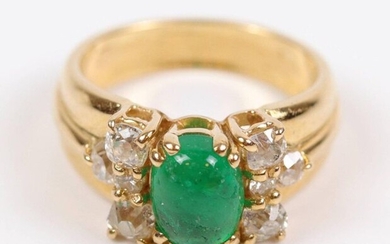 Yellow gold ring (750), cabochon emerald center (for about 0.80 carat), set with claw setting, surrounded by 8 small brilliants. T: 49, Weight: 7.2 gr.