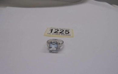 18ct white gold aquamarine and diamond ring. Emerald-cut aq...