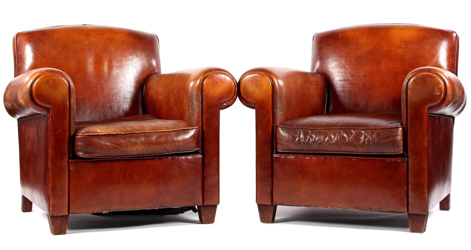 (-), 2 sheep leather armchairs with brass tack...