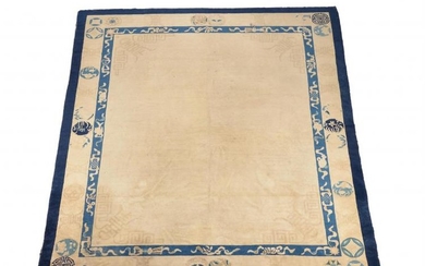 A Chinese pale yellow wool rug