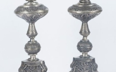 Pair of embossed silver candlesticks with wooden i…
