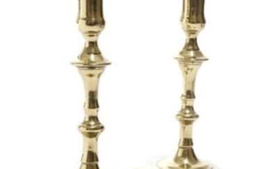 A pair of George II candlesticks, each with a knop…