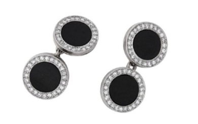 A pair of onyx and diamond cufflinks, first half of the