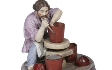 A Russian porcelain group "Peasant Ceramicist Throwing a Pot"...