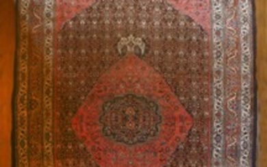 A Bidjar carpet, North-West Persia, c.1900, the indigo herati field with a large rose madder ...