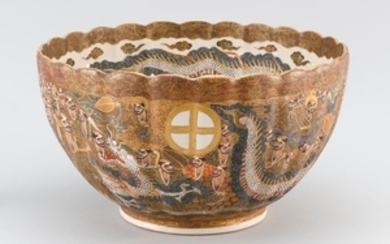 SATSUMA POTTERY BOWL In chrysanthemum form. Decorated on interior with relief dragons about a Shimazu crest. Exterior with dragons,...