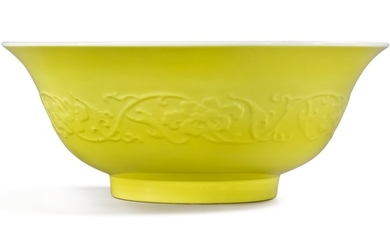 A RARE AND LARGE MOLDED LEMON YELLOW-BACKED FAMILLE-ROSE 'PEACH' BOWL YONGZHENG MARK AND PERIOD
