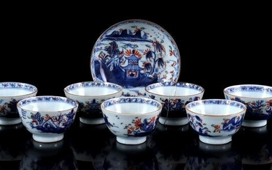 9 porcelain cups and 1 porcelain saucer with a blue and