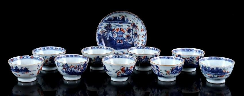 9 porcelain cups and 1 porcelain saucer with a blue and
