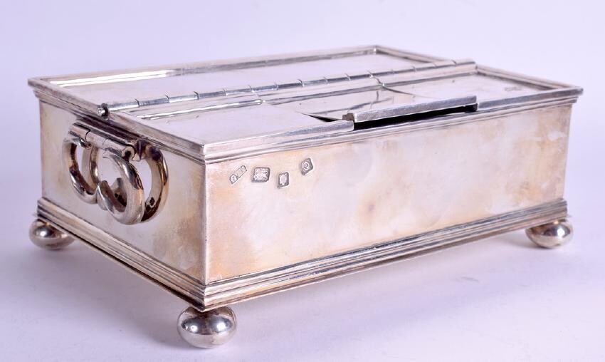 A QUEEN ANNE STYLE ENGLISH SILVER INKWELL formed up bun