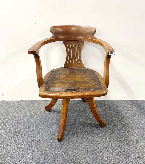 A 1920's oak swivel chair.