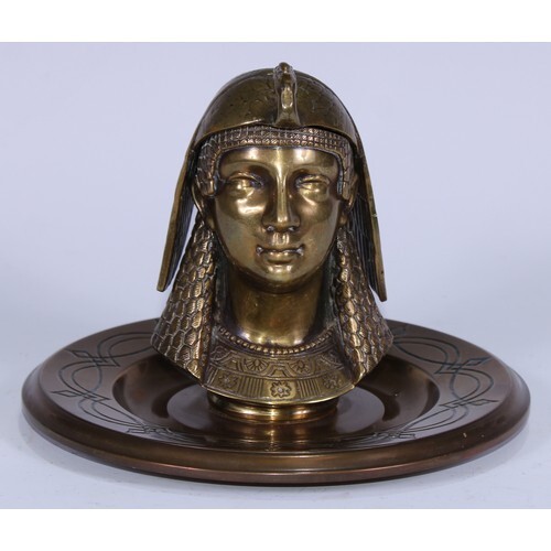 A 19th century Egyptian Revival gilt brass inkwell, cast as ...