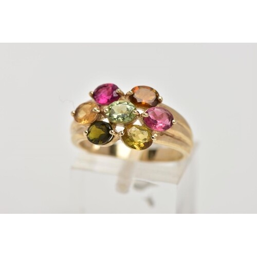 A 9CT GOLD GEM SET RING, of a cluster form, set with seven o...