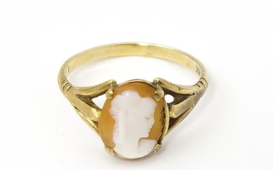 A 9ct gold ring set with classical cameo . Ring size approx....