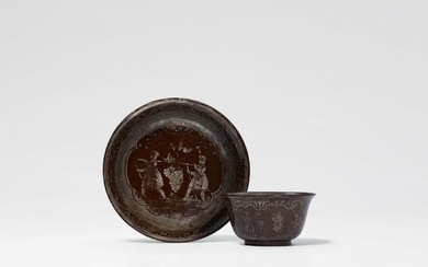 A Bayreuth red earthenware teabowl and saucer with a “Kalebstraube“