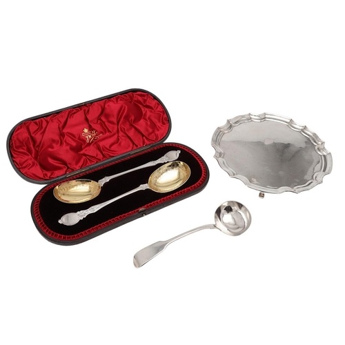 A CASED PAIR OF LATE VICTORIAN SILVER FRUIT SERVING SPOONS. ...