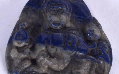 A CHINESE CARVED LAPIS PENDANT, forming a seated