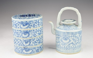 A QING DYNASTY BLUE AND WHITE TEAPOT AND STACKING BOXES