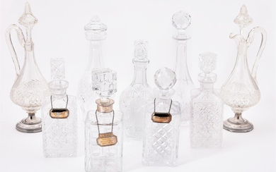 A COLLECTION OF NINE CUT GLASS DECANTERS