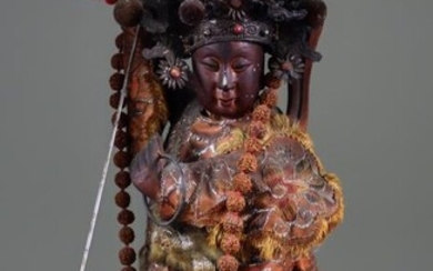 A Chinese Carved, Painted and Giltwood Standing Figure of...