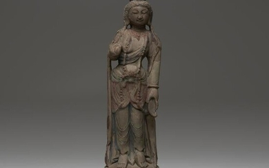 A Chinese carved and painted sandstone figure of a