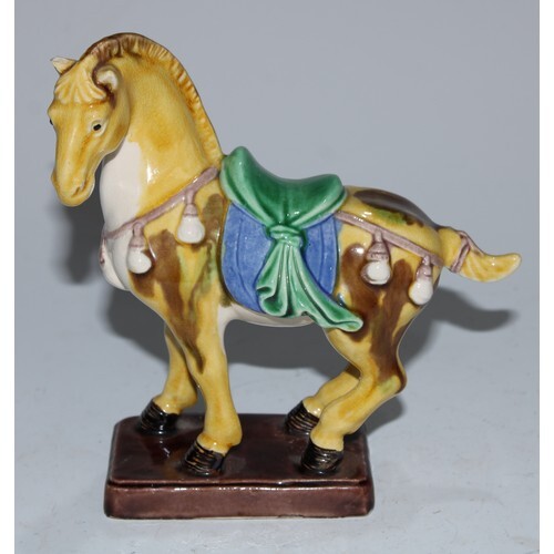 A Chinese sancai stoneware model, of a Tang horse, 14.5cm hi...