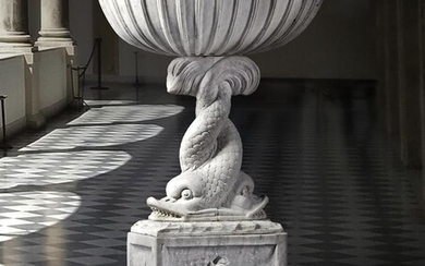 A Continental sculpted white marble basin on plinth