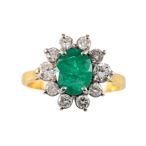 A DIAMOND AND GREEN GEMSTONE CLUSTER RING, mounted in 18ct y...