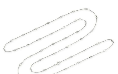 A DIAMOND CHAIN SAUTOIR NECKLACE in platinum, comprising a trace chain accented by lover's knot m...