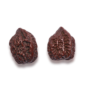 A FINE PAIR OF UNCARVED WALNUTS, QING DYNASTY (1644-1911)