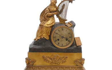 A French Charles X gilt and patineted bronze table clock, adorned with...