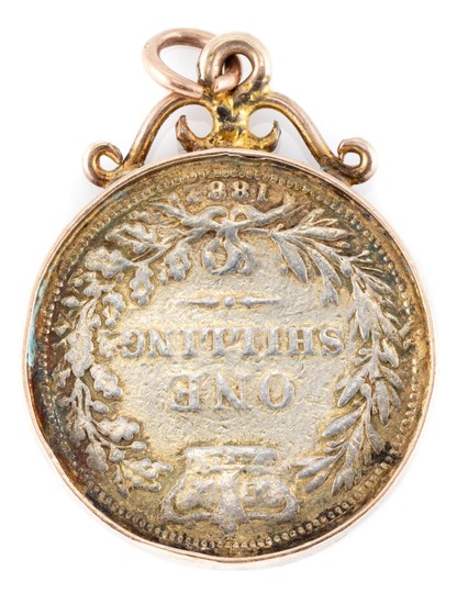 A GOLD FRAMED COIN PENDANT; 4mm wide frame with scroll surmount, tests 14ct gold, incasing an 1882 British shilling, wt. 7.89g.