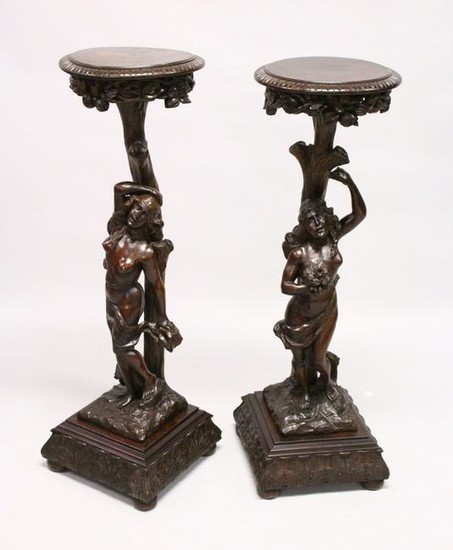 A GOOD PAIR OF CONTINENTAL WALNUT CARVED STANDS, EARLY