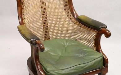 A GOOD REGENCY MAHOGANY BERGERE LIBRARY ARMCHAIR, of