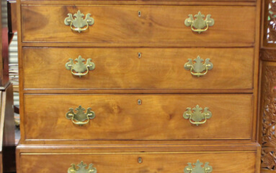 A George III figured mahogany chest-on-chest, fitted with two short and six long drawers, on bracket