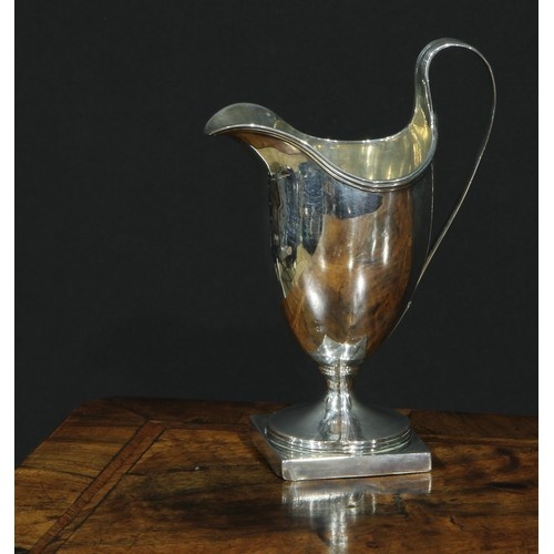 A George III silver helmet shaped cream jug, London 1773, 10...