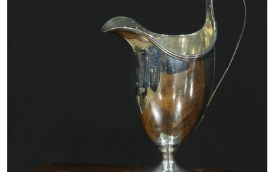 A George III silver helmet shaped cream jug, London 1773, 10...