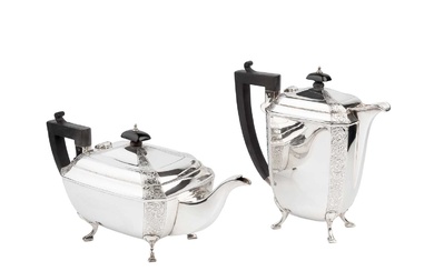 A George V silver teapot and matching hot water pot,...