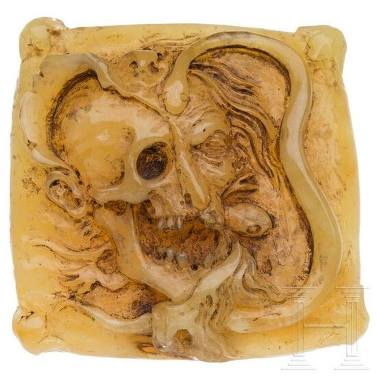 A German amber plaque with a memento mori in the style