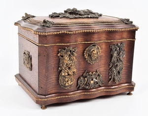 A German ormolu mounted oak cigar casket the shaped box wit...
